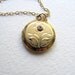 Vintage gold round locket 12k gold fill, diamond chip and flower on long 14k gf chain