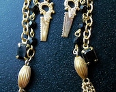 Macabre Fancy Gold and Black Rosary chain with Saw Dangle Vintage Tassel earrings OOAK