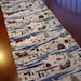 Holiday Table Runner with Santa in Winter Scene with Snowman and Reindeer Sleigh
