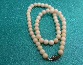 A Blushing Angel Skin Coral Necklace for a Blushing Bride