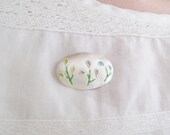 Enamelled fine silver stylised Spring flower brooch