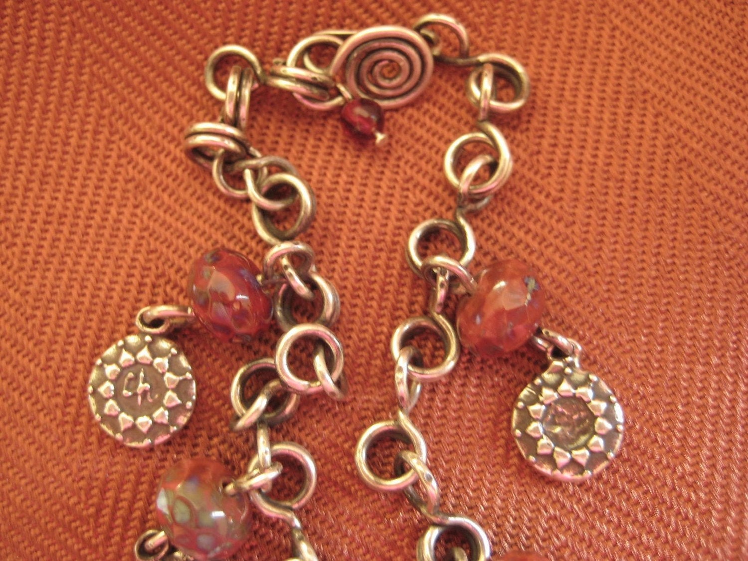 Vintage sterling silver bracelet, red translucent beads, silver charms, Handmade