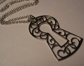 Keyhole pendant art nouveau scrollwork in sterling silver