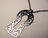 Keyhole pendant in copper art nouveau scrollwork