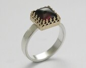 Sterling silver engagement ring with rose gold crown and deep red garnet gemstone - Wine kingdom