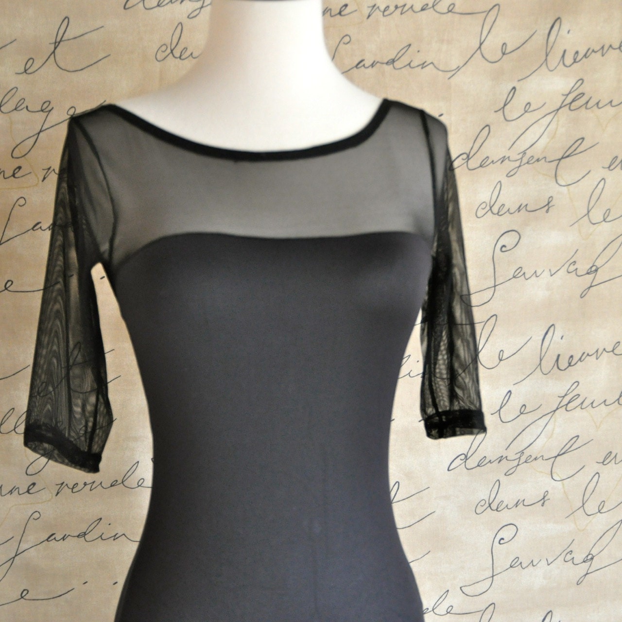 Black sheer neckline 3/4 sleeve leotard and open back. Matches many tutu tulle skirts at TutusChic.