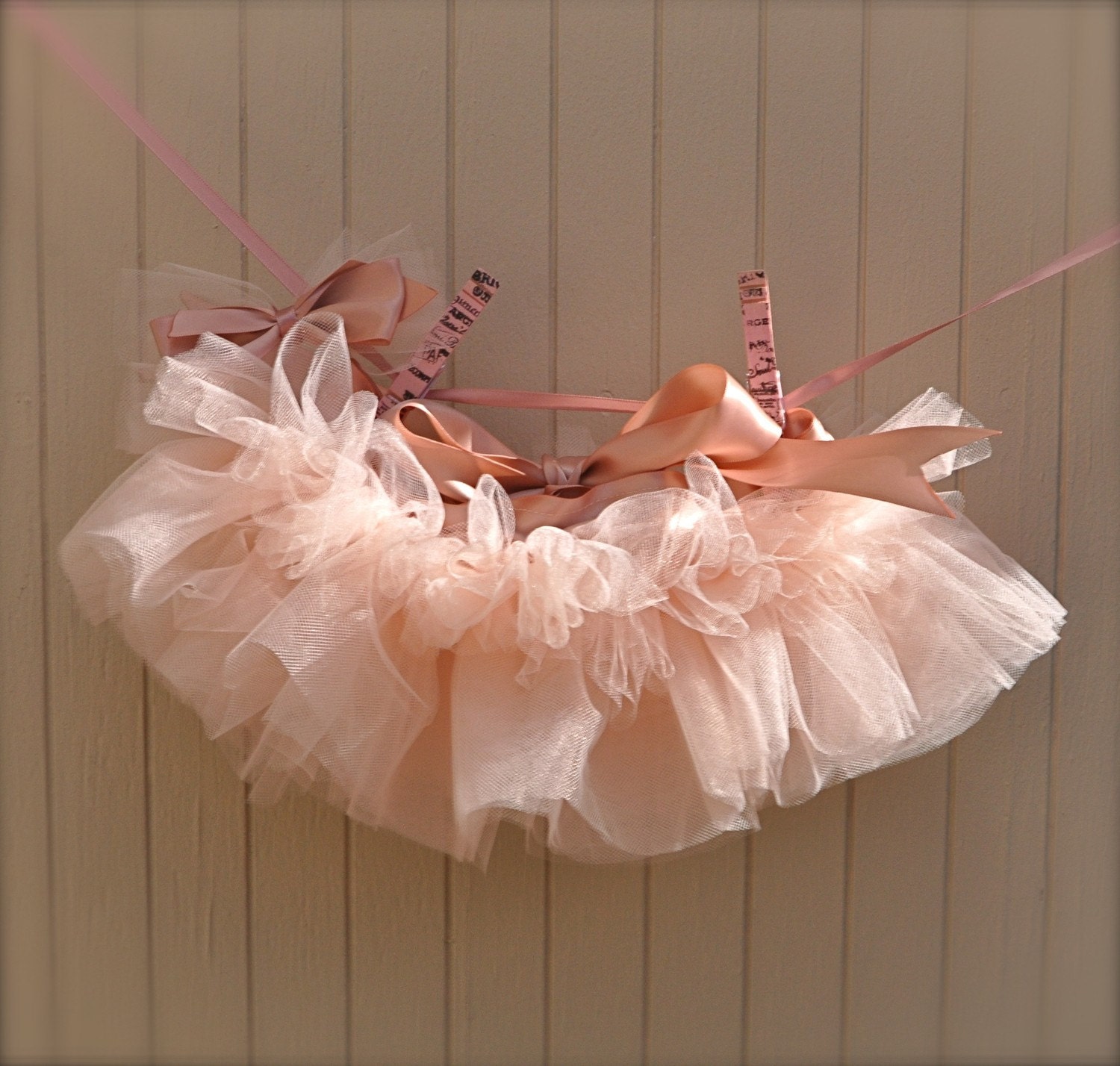 Newborn Tutu--Baby Ballerina vintage pink . Teeny, tiny and can be hung in the nursery. Clothes pins and ribbon included.