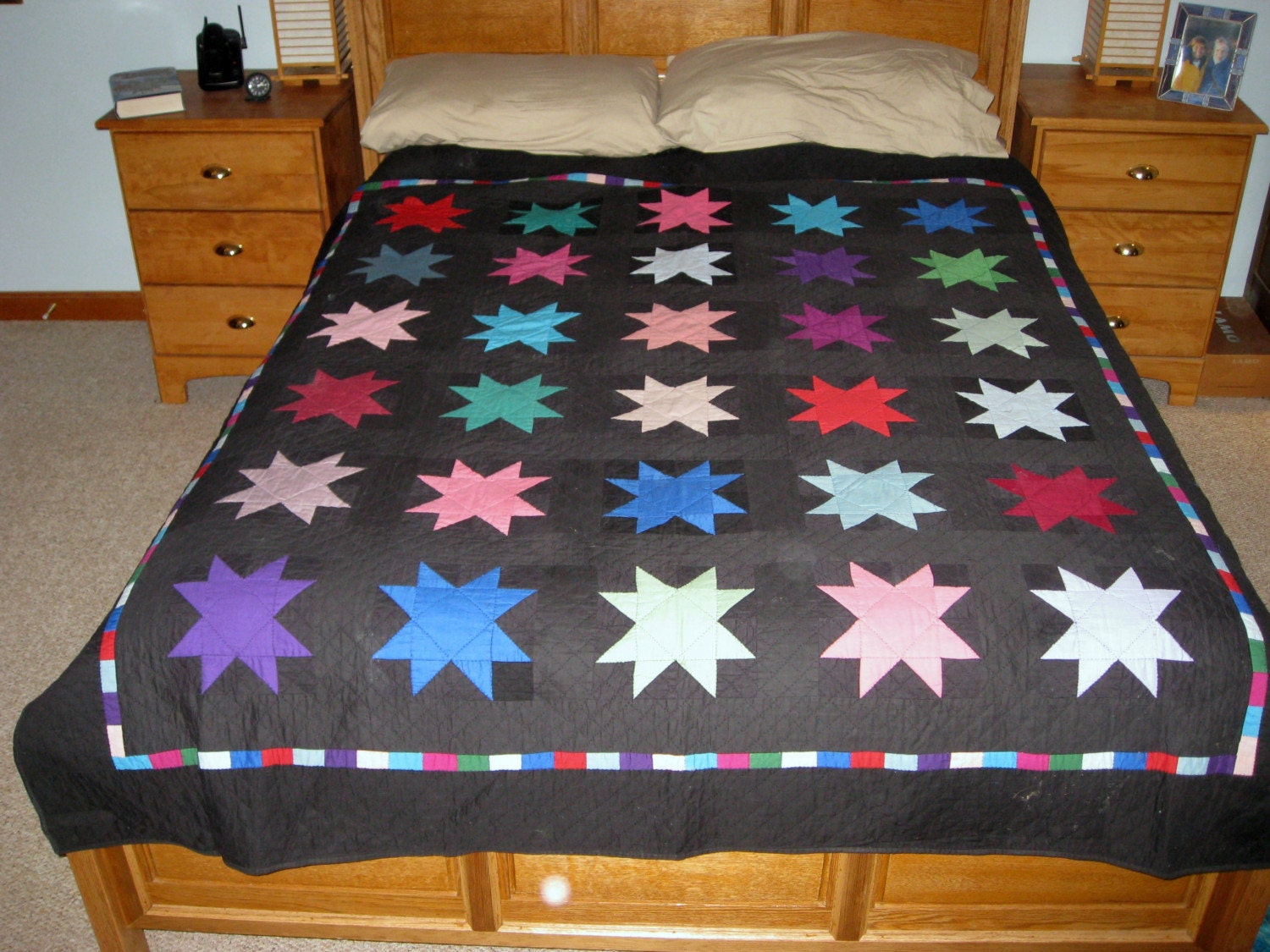 Quilt -- Amish Style Multicolored Stars Against Black