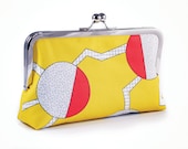 Yellow clutch with circles and zigzags