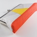 Clutch purse with yellow triangle