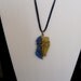 Dark blue/yellow tumbled bottle glass ,brass wrapped necklace on blue suede cord