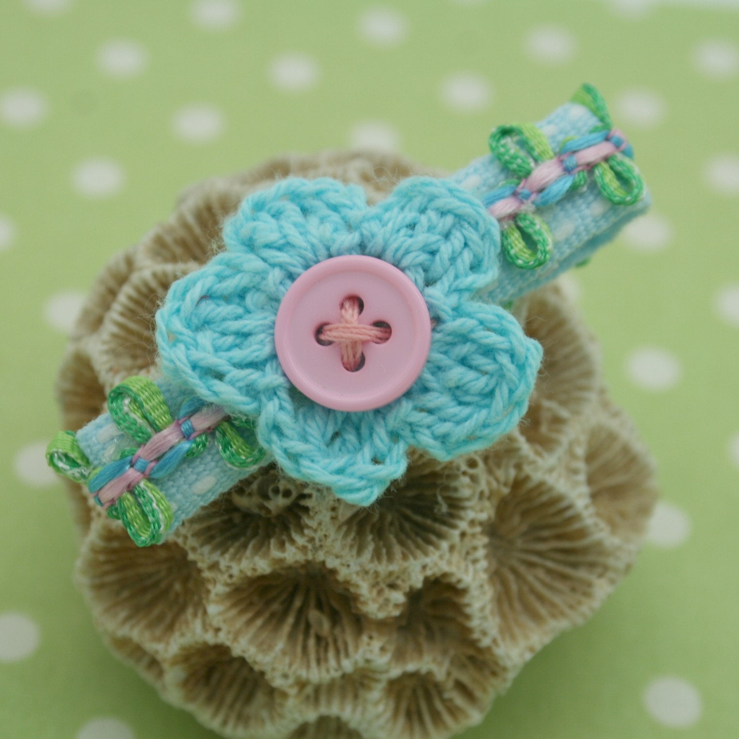 a pair of crochet flower clips