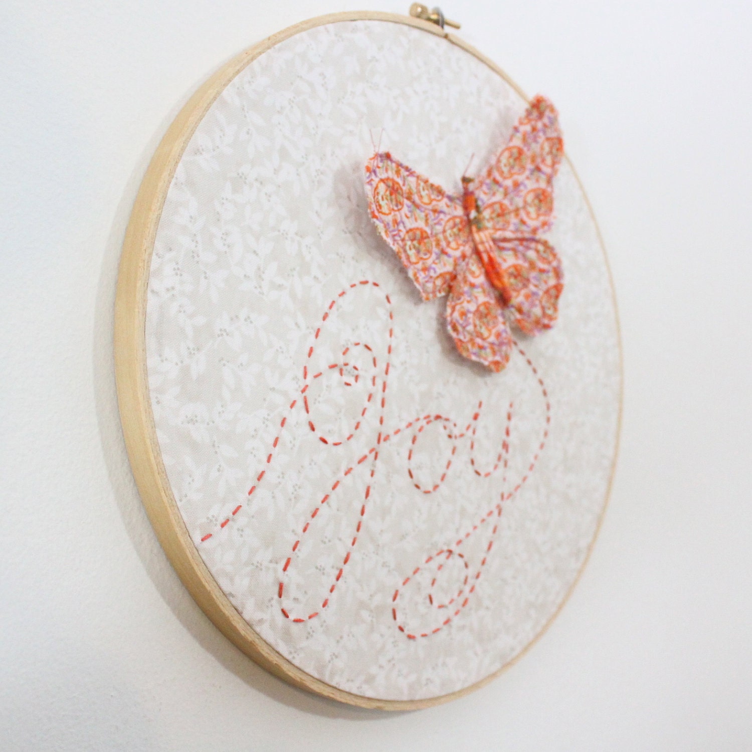 Butterfly Embroidery Hoop - Joy Flutters In - hand embroidered 10" wall hanging in peach, coral pink, beige, white, and lilac