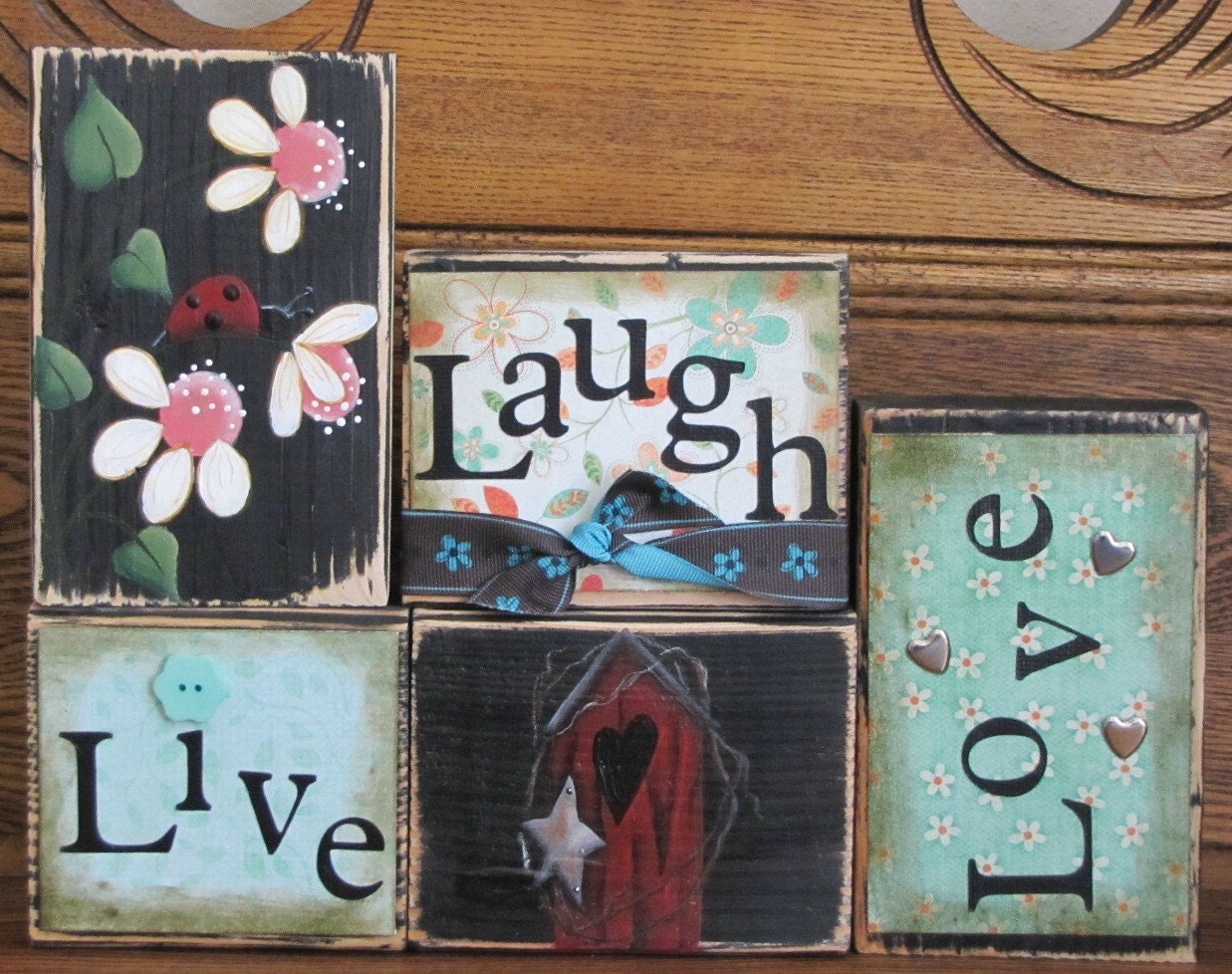 Live, Laugh, Love Sign Blocks with Flowers and Ladybug