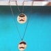 Pendant. Dandy printed in wooden circle