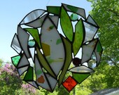 round orange, green and white stained glass suncatcher