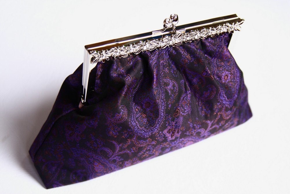 The stylish purple clutch with silver rhinestone frame