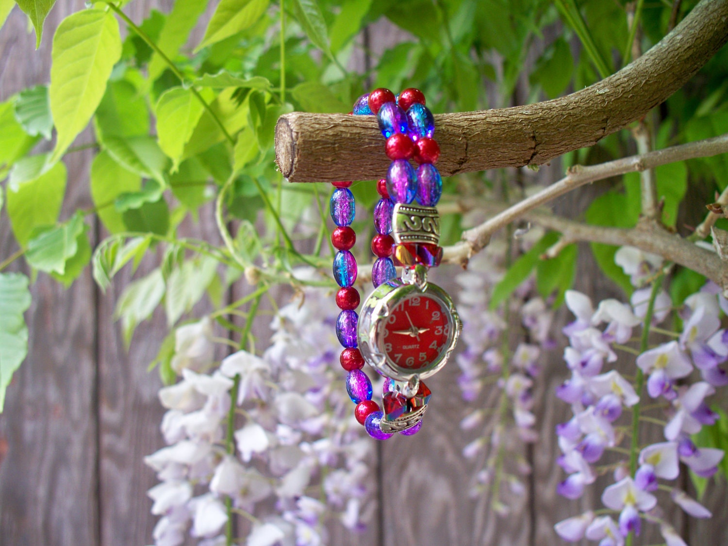 Lovely Bracelet Watch Pink, Blue, Red, and Silver Makes a practical and pretty combination