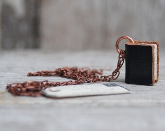 Book Necklace: Not Complicated, black leather with brown edge, small.