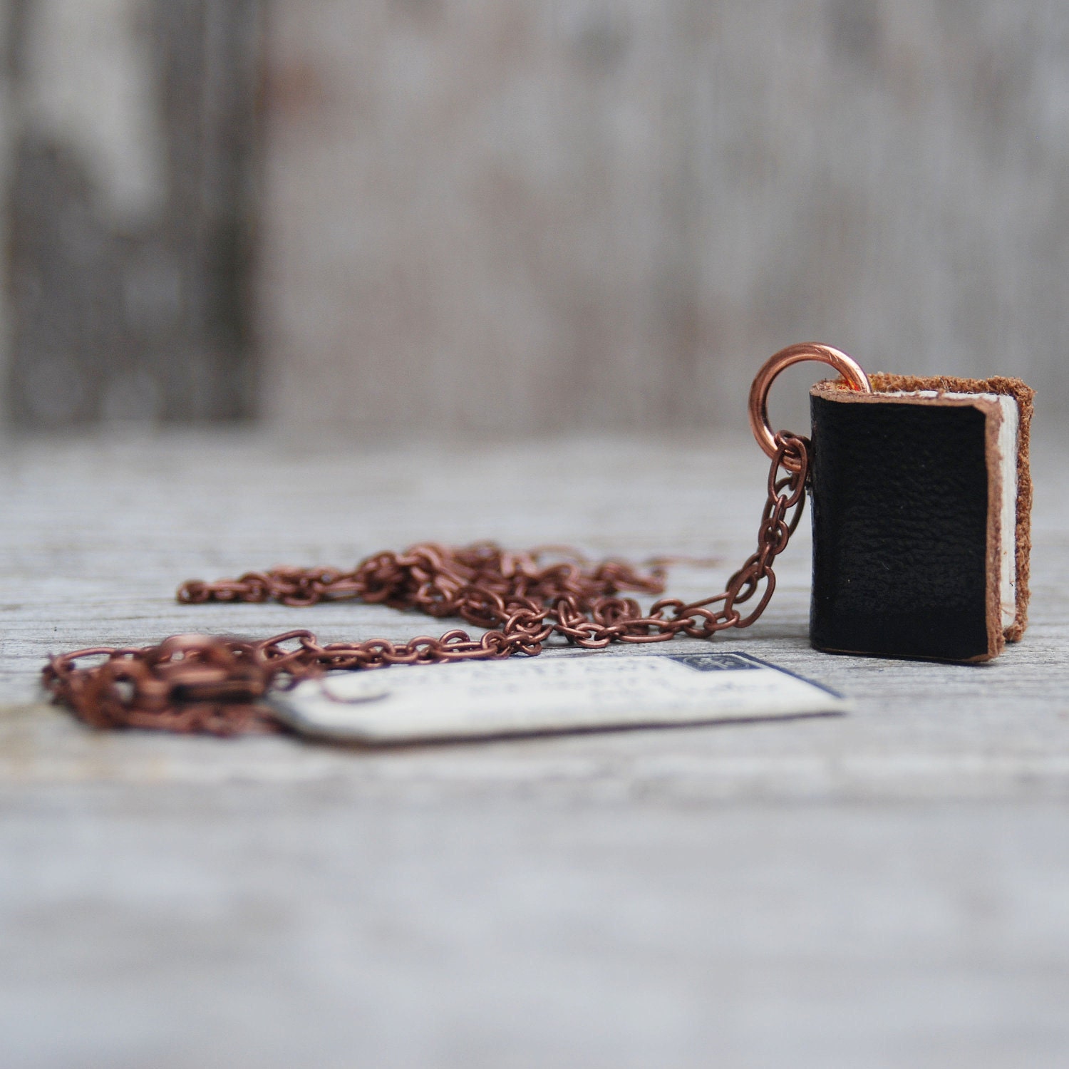 Book Necklace: Not Complicated, black leather with brown edge, small.