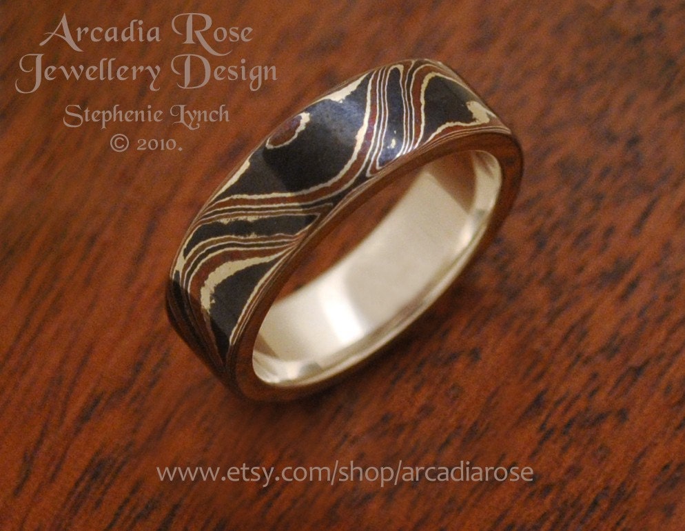 Size 7 3/4. (U.S.) Size P 1/2. Mokume Gane Wave Double Ring/Sterling Silver Liner by Stephenie Lynch.
