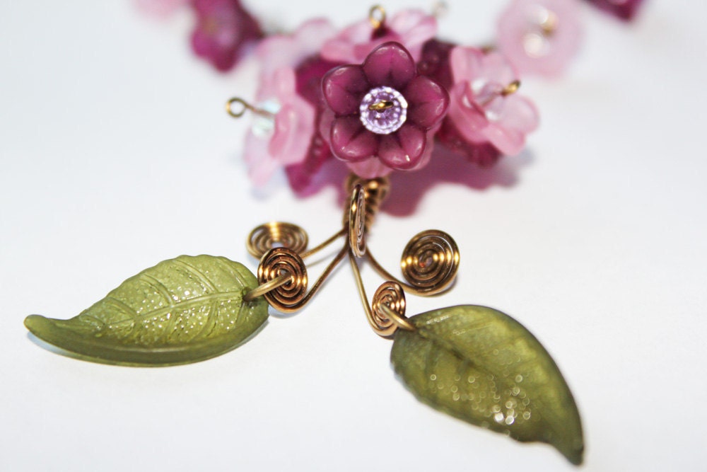 A Bouquet of Mauve and Pink Flowers in Brass Necklace