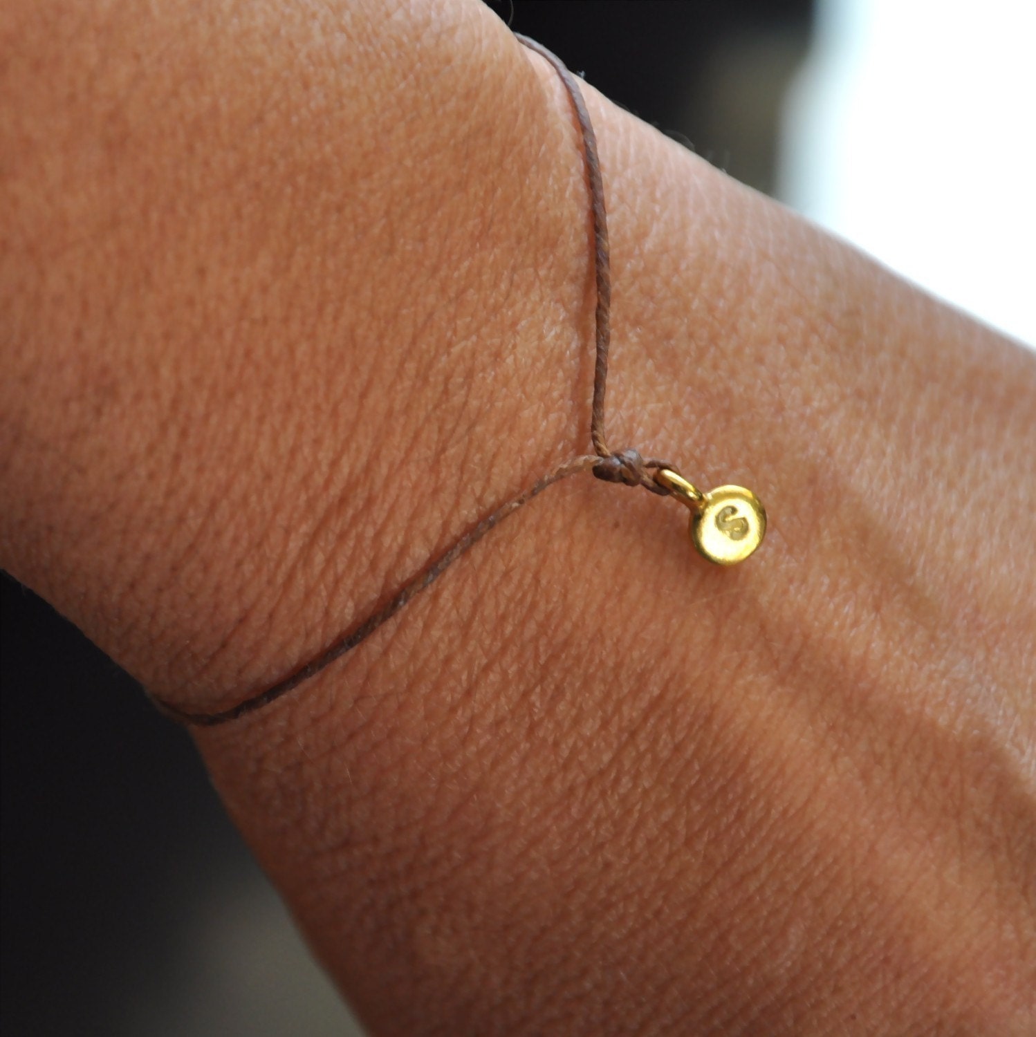 Hand stamped wish bracelet. Tiny Gold charm on  waxed Irish linen cord