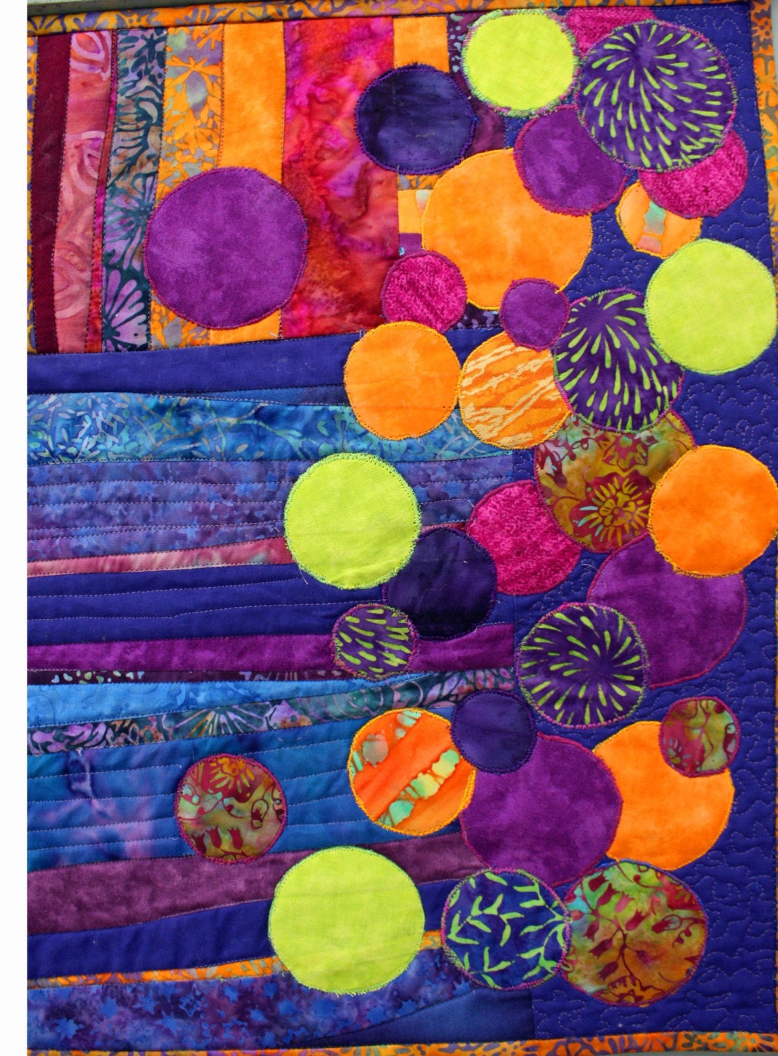 Abstract quilted art an original in blue, gold and purple batiks