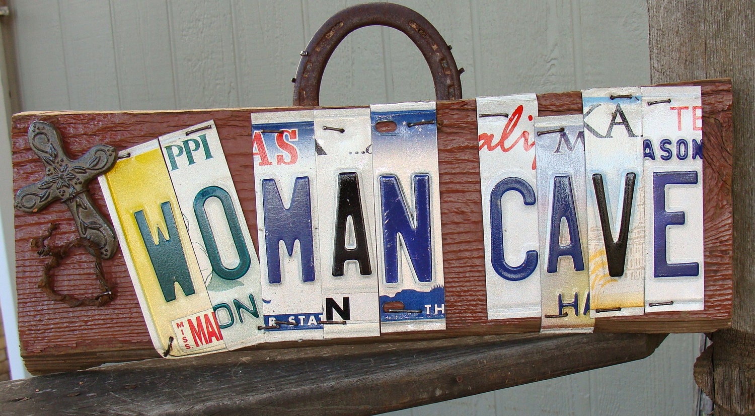 woman cave sign