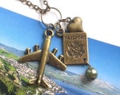 The Globetrotter's Necklace with Airplane, Passport and Heart Charms in Antique Gold