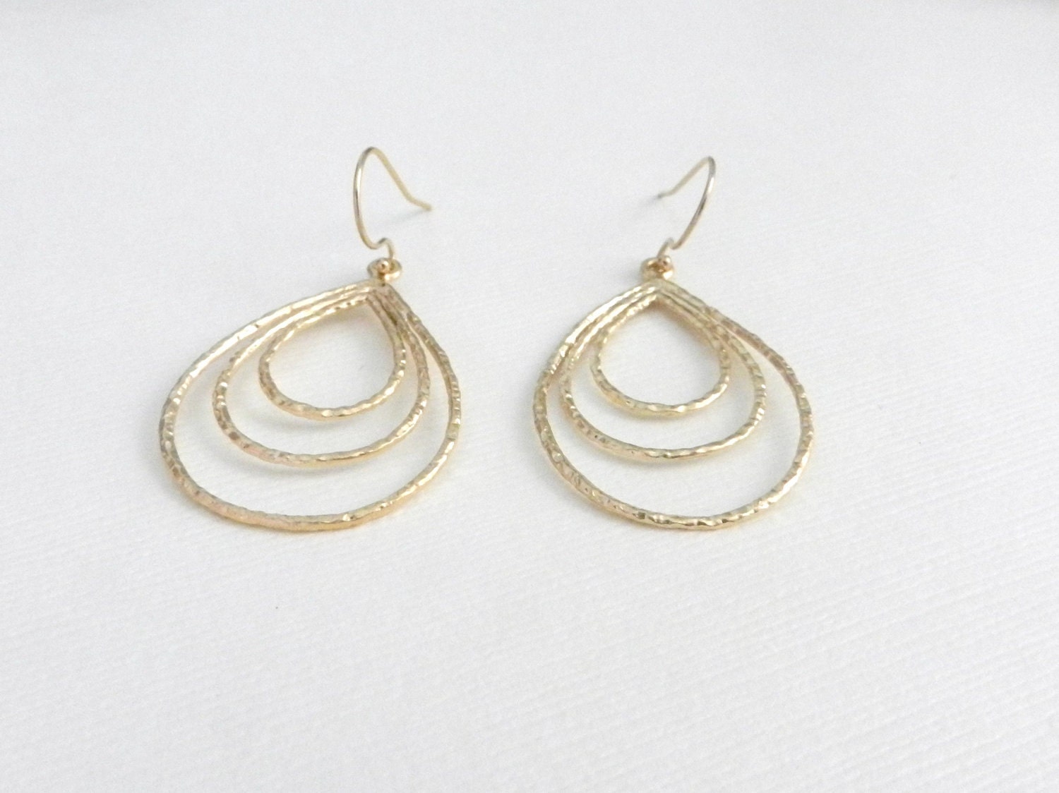 Golden triple teardrop earrings, elegant modern jewelry