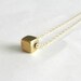 Tiny brass cube, geometric necklace, sleek modern jewelry