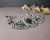 Silver wire wrapped bracelet with  black spinel and amethyst