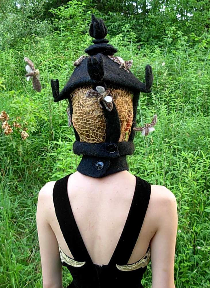MOTH LAMP HAT -- Needle Felted Wool with golden crochetted light panels that moths are swarming around.