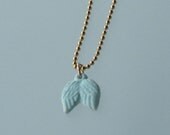 tiny pale blue wing necklace
