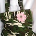 camouflage and pink purse