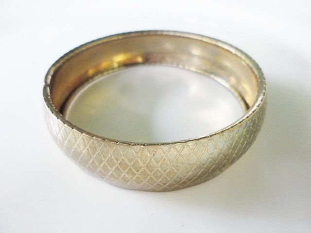 vintage wide bangle bracelet in a solid goldtone