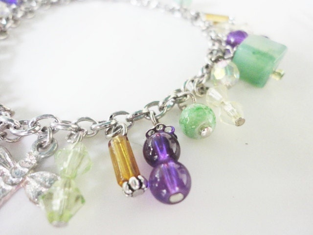 adorable charm bracelets with green and purple dangling beads