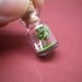 Tiny green tree and a couple in a tiny bottle ver.4