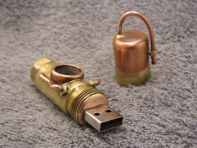 steampunk USB flash drive 8 GIG and micro SD card reader in one. Upgradeable memory.
