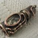 Steampunk USB flash drive with glowing glass windows. 16 GIG. Copper, brass, watch parts and glass. Waterproof.