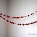 Romantic Paper Hearts Garland - red with a single white heart, 10'