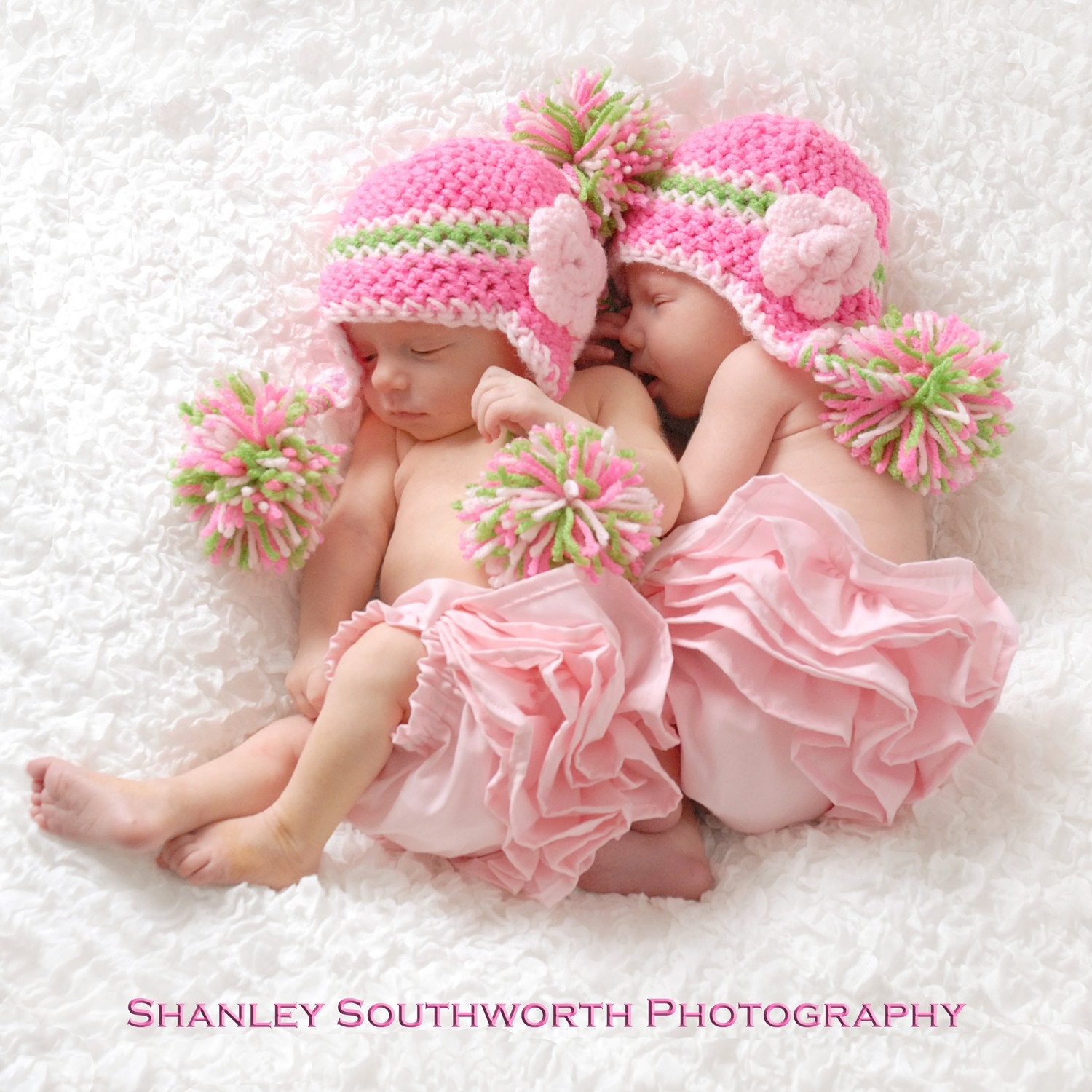 Hot Pink, Lime Green and Light Pink Earflap Hat with a Light Pink Flower and Pom Poms