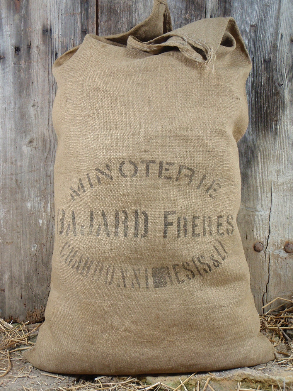 Vintage cotton or flour bags filled to look like bags of cotton
