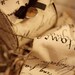 10 yard roll of wired black french labels on natural linen