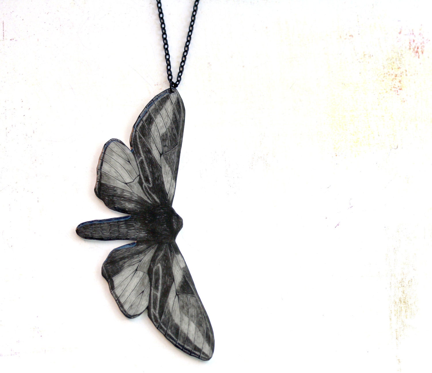 Moth necklace -pendant, drawing on plastic