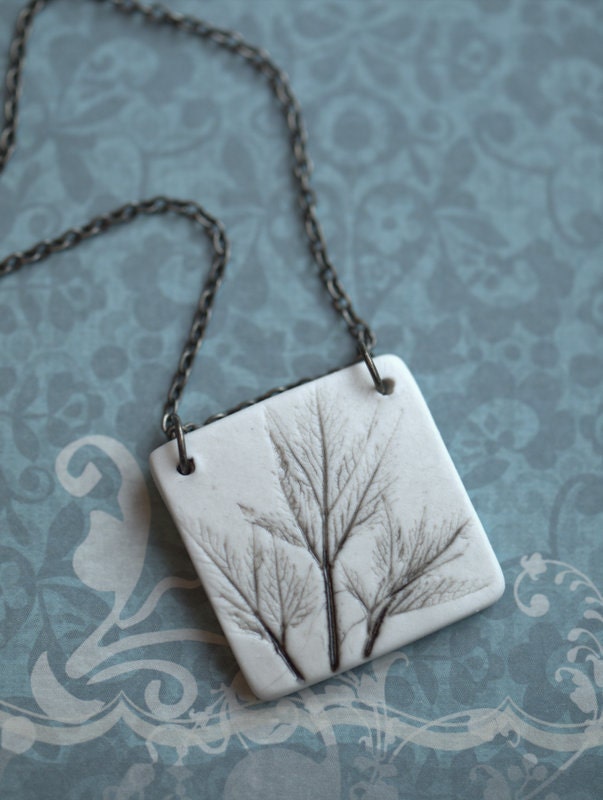 Earthy Porcelain Pendant with Impression of small leaves.