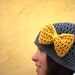Minnie's Grey Crochet Hat with Bright Yellow Bow