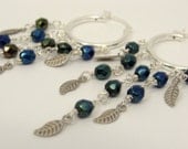 Sterling silver hoop earrings with dark blue green metallic beads and leaves Bohemian