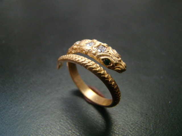 14k Gold amazingly detailed snake ring with diamonds and emerald eyes.